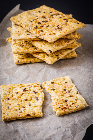 stack of healthy crackers with oat and sesame seedsの写真素材
