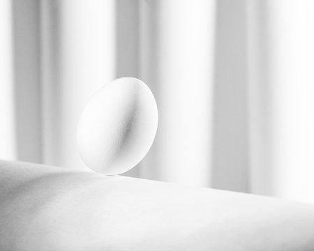 white eggs creative image on white backgroundの写真素材