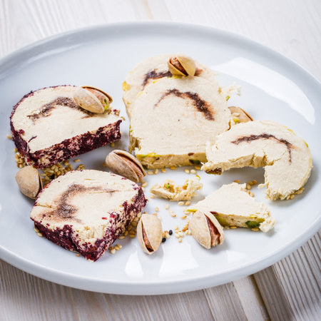 Assorted traditional oriental turkish delights and nuts on wooden background