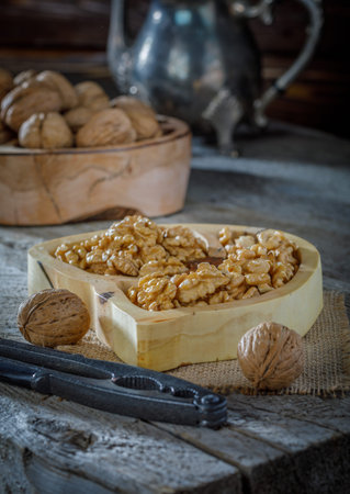 still life with walnuts on wooden background