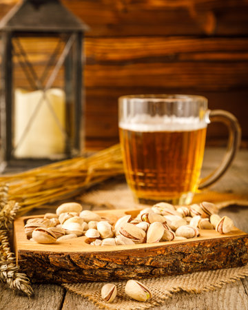 still life with pistachios and almonds on wooden backgroundの写真素材