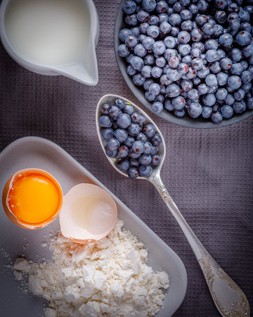 still life with forest blueberries on wooden backgroundの写真素材