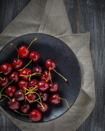 still life with cherries on a wooden tableの写真素材