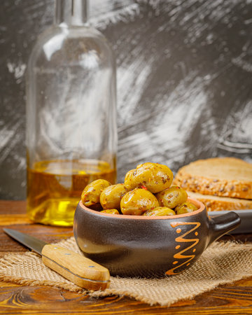 Still life with marinated olives in a bowlの写真素材