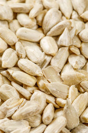 close up of sunflower seeds in a spoonの写真素材