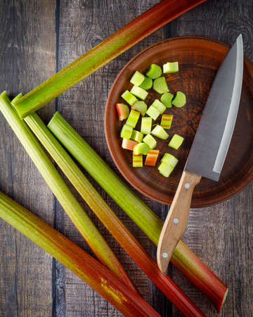 still life with fresh organic rhubarb on wooden backgroundの写真素材