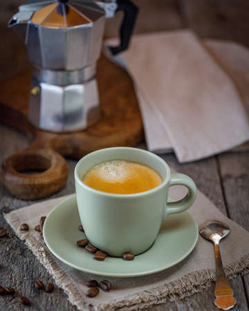 cup of coffee and beans on the tableの写真素材