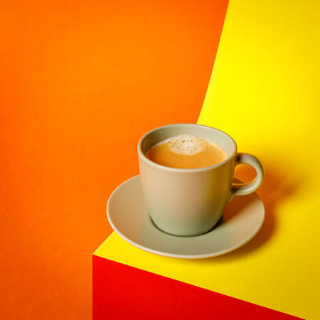 cup of coffee on a multi colored background, copy spaceの写真素材