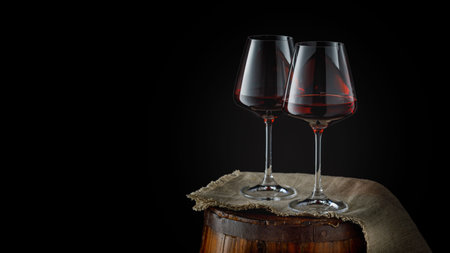 Still life with glasses of red wine on wooden background, copy space