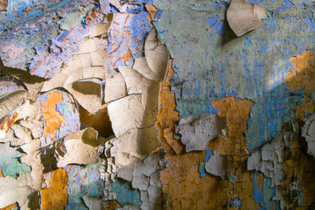 wall with paint peeling and cracking