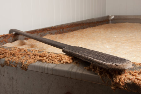 Beer mash into the fermentation vessel and a mixing spatula
