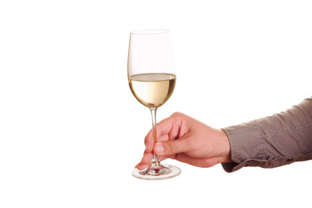 Male hand with white wine glass on a white backgroundの写真素材