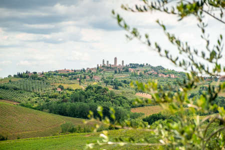Landscape with the medieval city of San Gimignano in Tuscany, province of Siena, Italyの写真素材