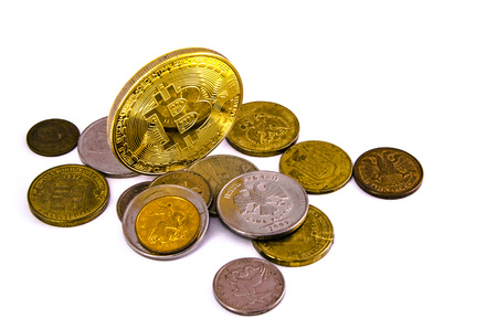 Bitcoin golden on top of other coins isolated on white backgroundの写真素材