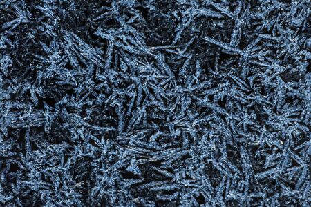 texture blue frosty pattern on black glass seamlessの写真素材