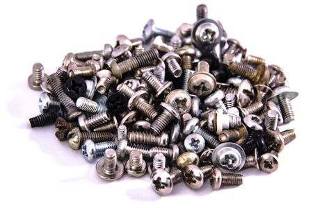 bunch of screws macro closeup on white background isolatedの写真素材