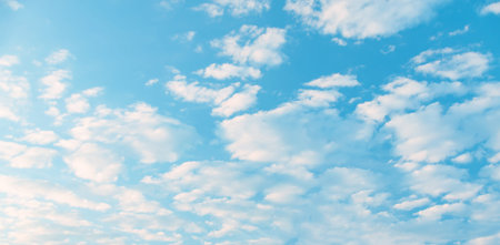 white Cumulus clouds in a blue sky