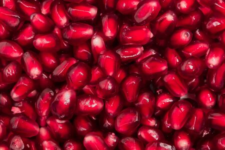 fresh pomegranate seeds macro close-up in drops の写真素材