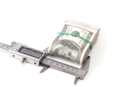 caliper and money isolated on white background