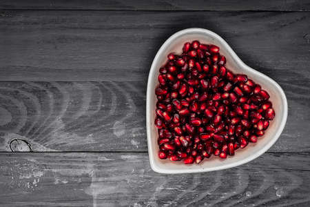 grains garnet in dish on blackの写真素材