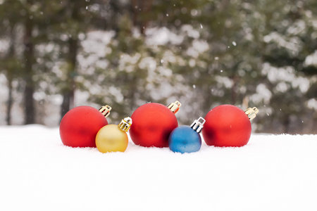 Christmas balls of snow with rays of the sunの写真素材