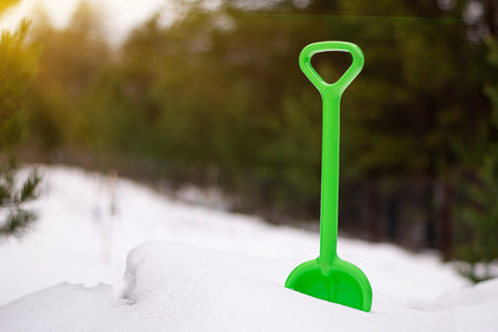 Shovel children toy. Kinds shovel in fresh snow.の写真素材