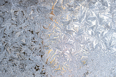 New Year and Christmas abstract icy snowy background with real ice crystals macro in cold blue tones