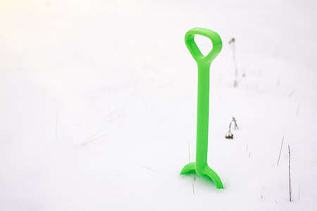Shovel children toy. Kinds shovel in fresh snow.の写真素材