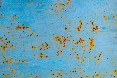 The texture of cracked blue paint on an iron sheet. Fragment of an old metal gate, Metal corrosionの写真素材
