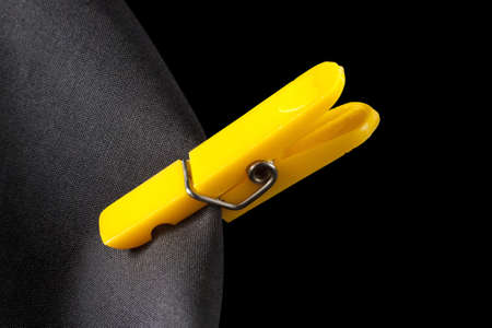 Yellow laudry clip and black cloth  の写真素材