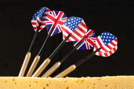 A bunch of darts with flags of the USA and the United Kingdomの写真素材