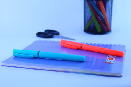 Colorful Pen And Pencils And Book And Scissor