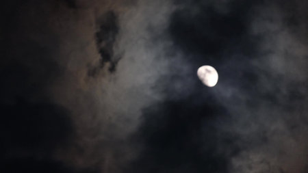 Full moon timelapse with clouds in the dark sky. Night sky.
