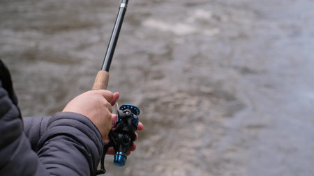 A man fishing on a mountain river. Fishing concept