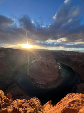 Witness the breathtakingly beautiful stunning sunset over Horseshoe Bend in Arizona, USAの写真素材