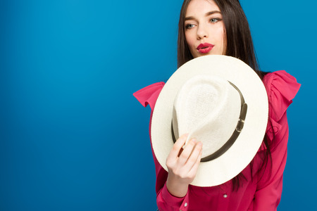 Beautiful woman in hat. Retro fashion. Blue Backgroundの写真素材