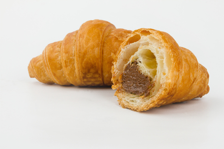 Delicious croissants with cherry jam on a white background.の写真素材