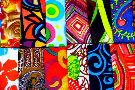 12 samples of colored fabrics with patterns
