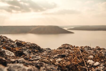 Majestic sunset in the mountains landscape over a calm lakeの写真素材