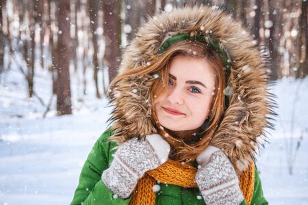 Young woman winter portrait. Close-up portrait of happy girl.の写真素材