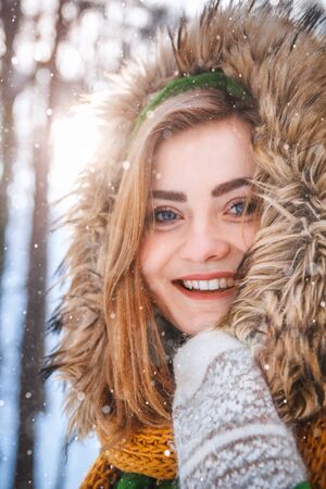 Young woman winter portrait. Close-up portrait of happy girl.の写真素材