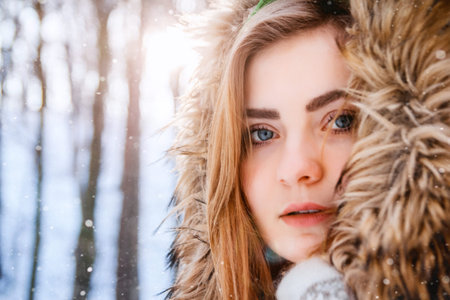 Young woman winter portrait. Close-up portrait of happy girl.
