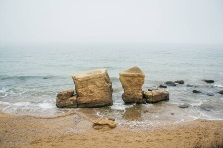 Beautiful wild Beach Fontanka near Odessa. Yellow and red sandstone cliffs are located on the seafrontの写真素材