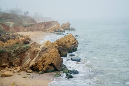 Beautiful wild Beach Fontanka near Odessa. Yellow and red sandstone cliffs are located on the seafrontの写真素材