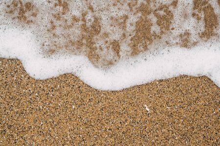 Soft ocean wave on sandy beach, backgroundの写真素材