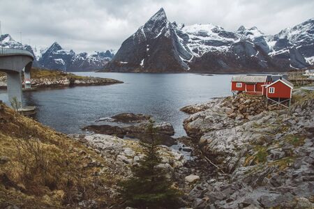 Norway rorbu houses and mountains rocks over fjord landscape scandinavian travel view Lofoten islandsの写真素材