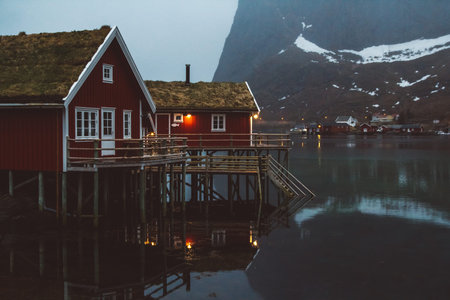 Norway rorbu houses and mountains rocks over fjord landscape scandinavian travel view Lofoten...