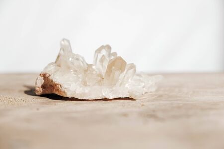 Quartz crystal on a wooden background. Copy, empty space for text.の写真素材