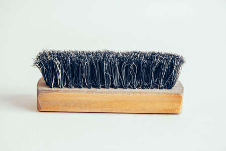 Wooden brush for clothes on a white backgroundの写真素材