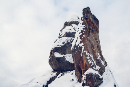 The top of the mountain is covered with snow. Mountains covered with snow. For background